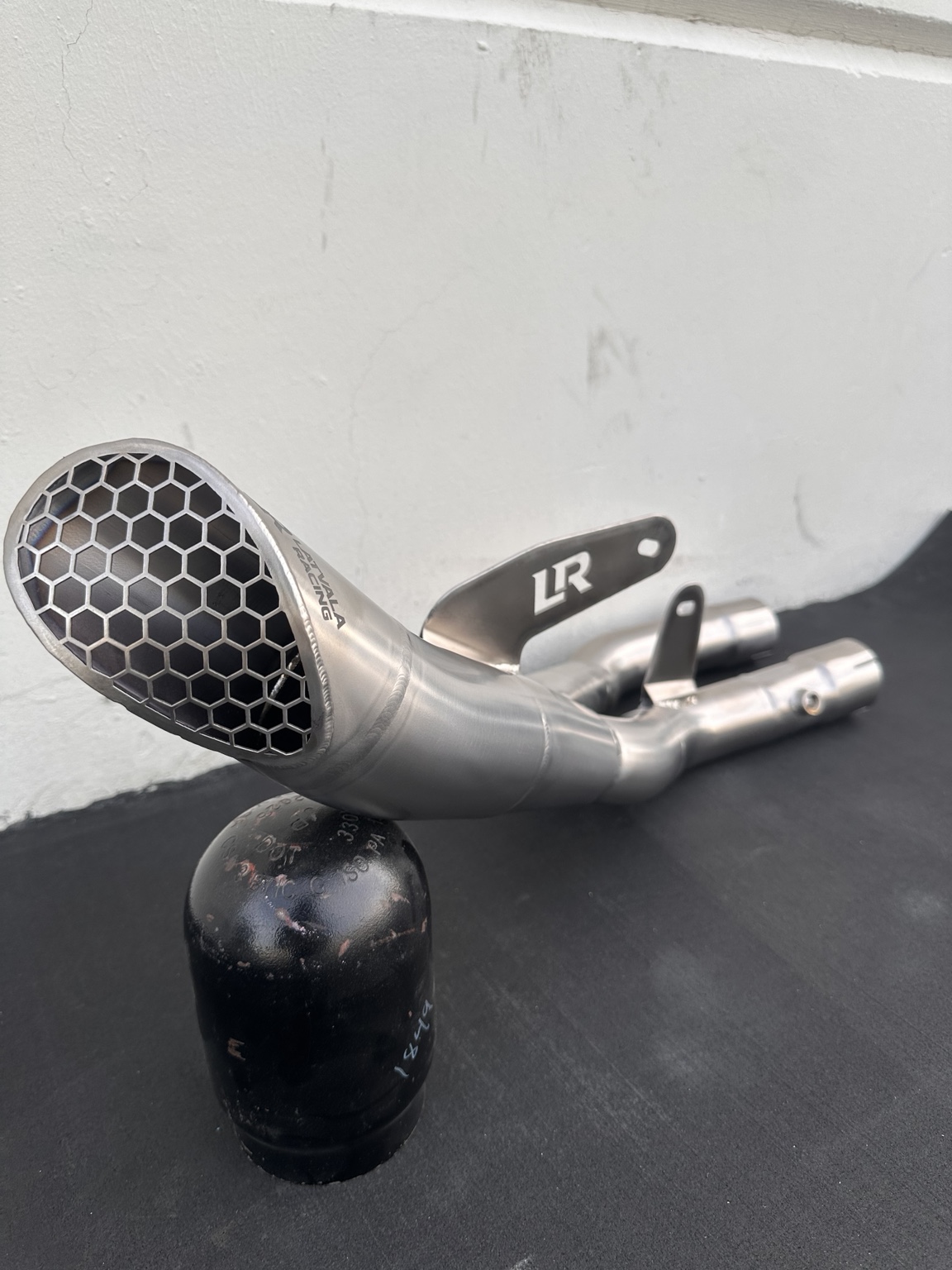 Close angle on brushed titanium hex tip